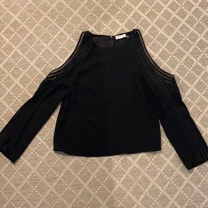 Cold shoulder with arm detail. Zip up on top back. Lower back vented